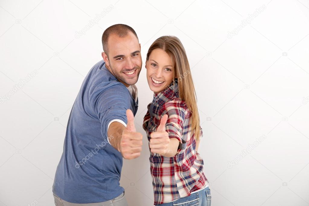 Couple showing thumbs up