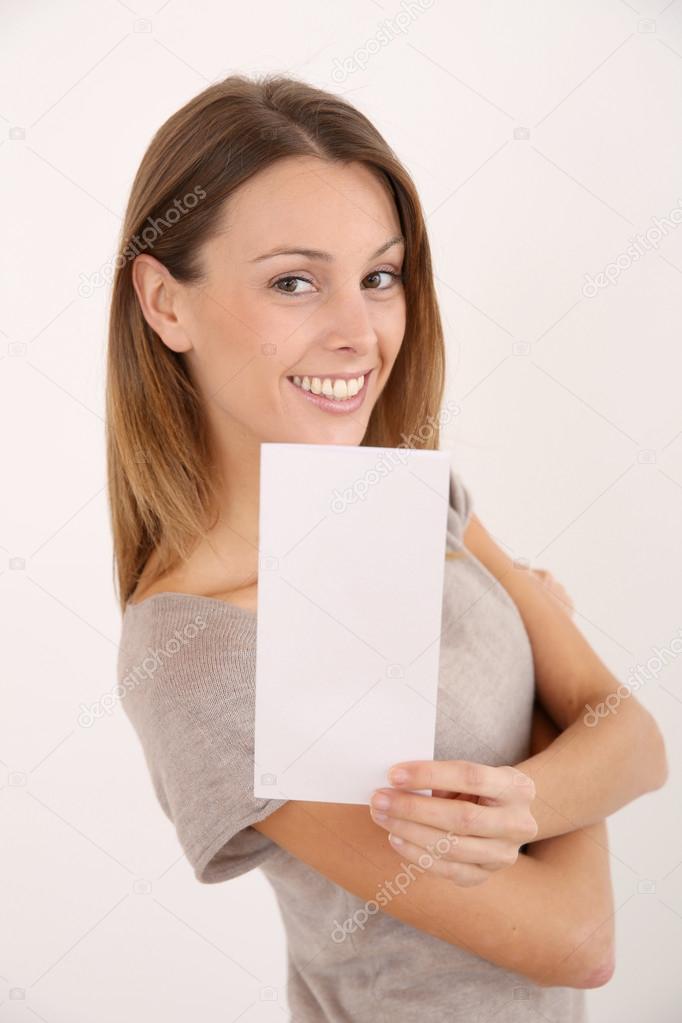 Smiling girl holding leaflet for message