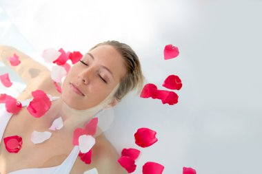 Woman relaxing in spa clipart