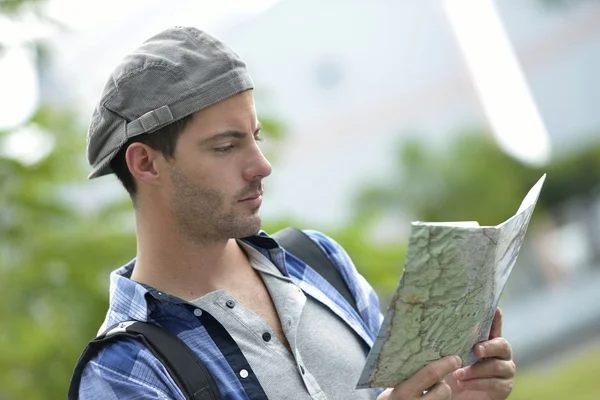 Adventurer looking at street map — Stock Photo, Image