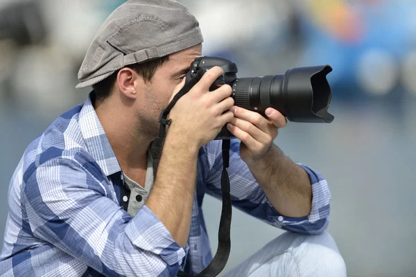 Photographer checking on shots — Stock Photo, Image