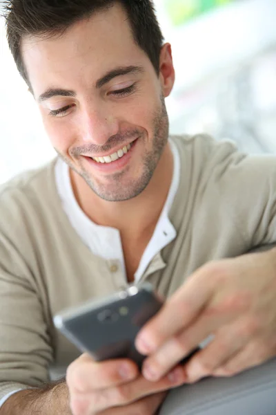 Man connected on smartphone Royalty Free Stock Images