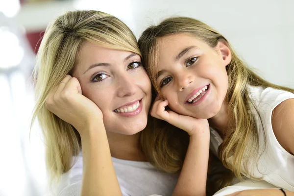 Little girl cuddling with her mom — Stock Photo, Image