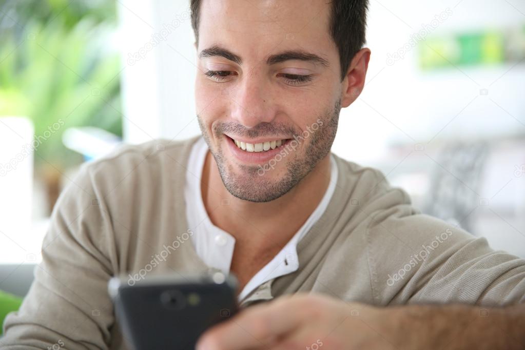 Man connected on smartphone