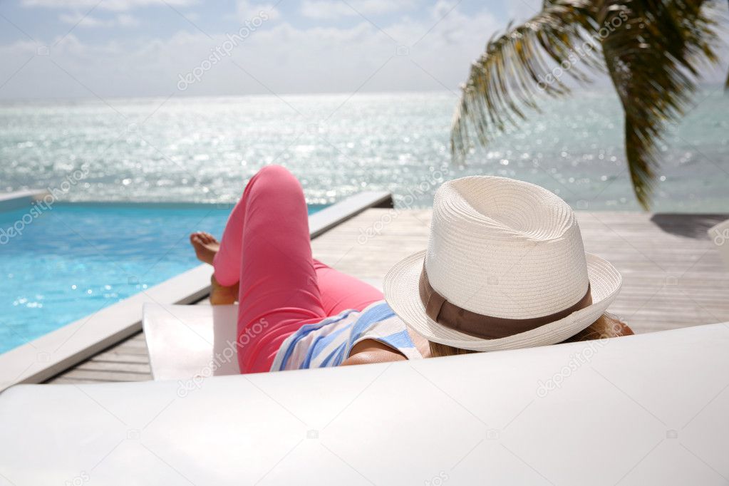 Woman relaxing in deck chair