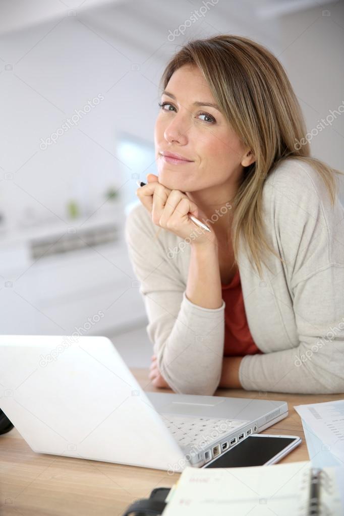Businesswoman working in laptop