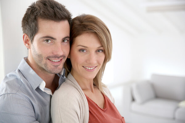 Couple standing in home