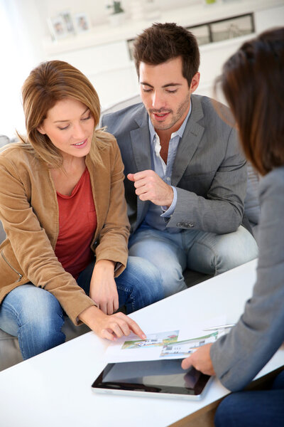 Couple meeting financial adviser