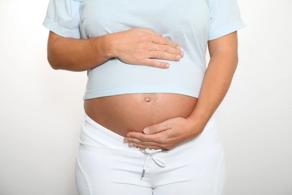 Pregnant woman 's belly — стоковое фото