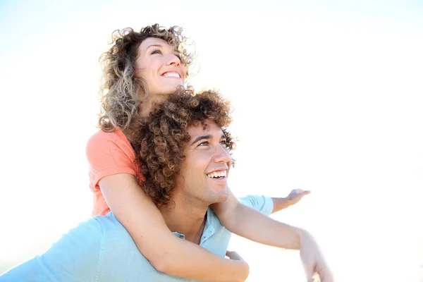 Man giving piggyback ride — Stock Photo, Image