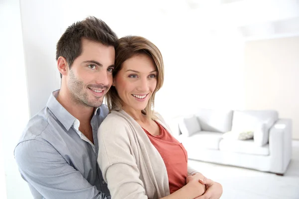 Couple standing in home Stock Photo