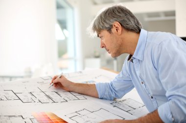 Architect designing house clipart