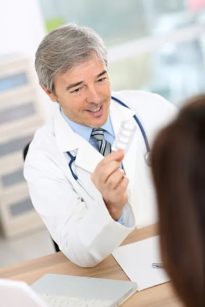 Doctor in consultation room — Stock Photo, Image