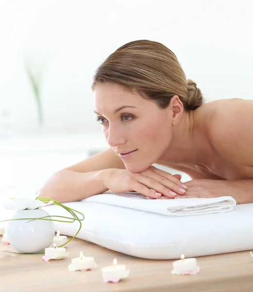 Woman on massage bed — Stock Photo, Image