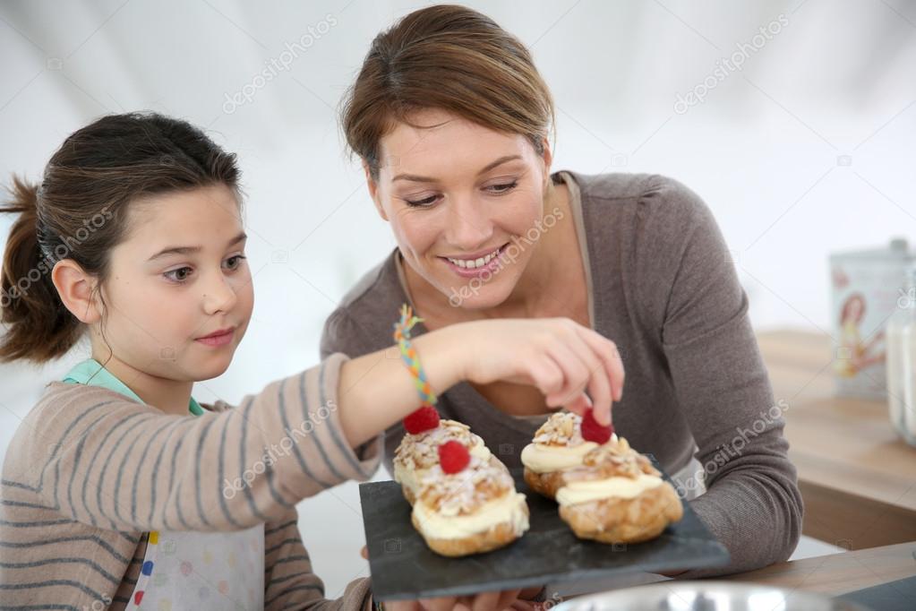 Mother and daughter preparing puffs