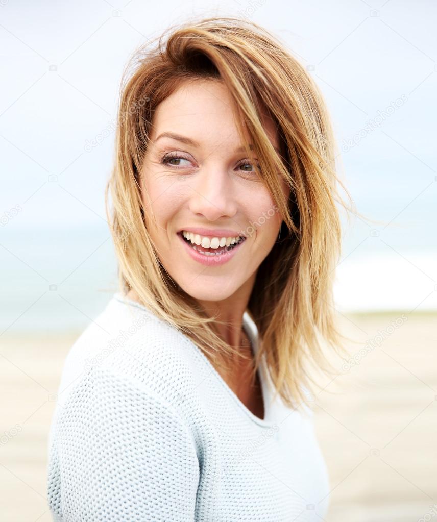 DepositphotosMature woman on beach Stock Photo by