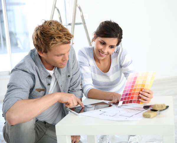 Couple choosing wall paint colors