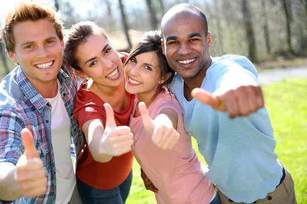 Students showing thumbs up — Stock Photo, Image