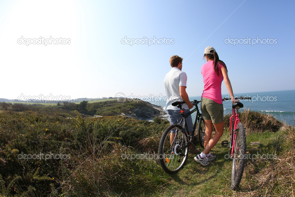 Couple stopping by coastline