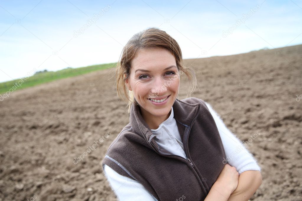 Woman standing on farming land