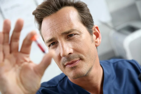 Vet doctor checking on blood sample — Stock Photo, Image