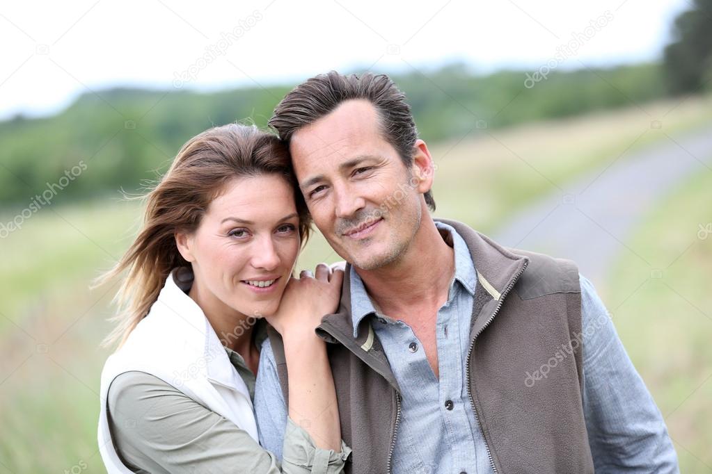 Cheerful couple in countryside