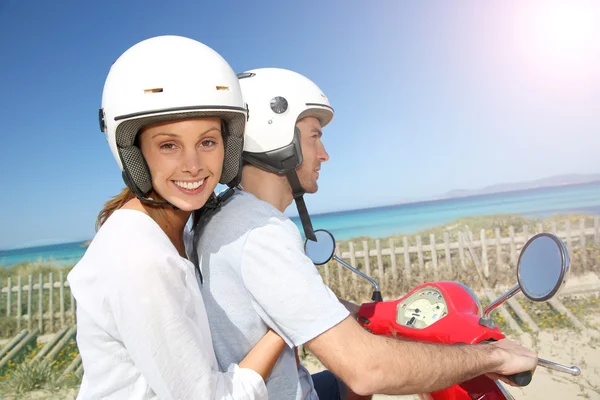 Girl riding moto with boyfriend — Stock Photo, Image