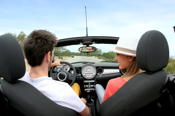 Couple driving convertible car — Stock Photo, Image