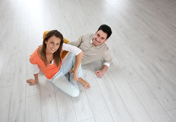 Couple on flooring — Stock Photo, Image