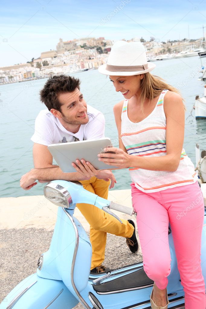 Tourists websurfing with tablet