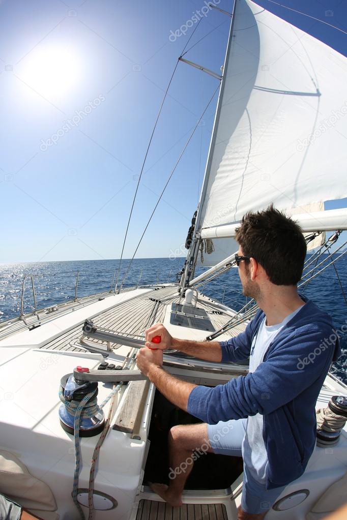 Man sailing with sails out