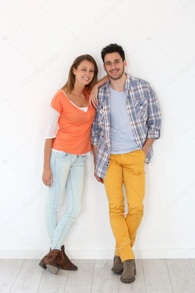 Couple leaned on wall