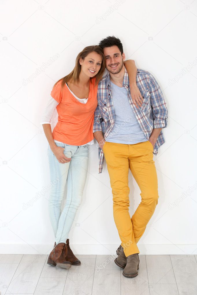 Couple leaned on wall