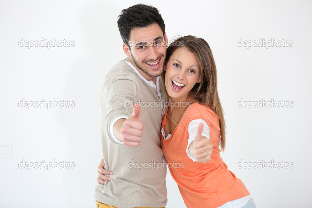 Couple showing thumbs up