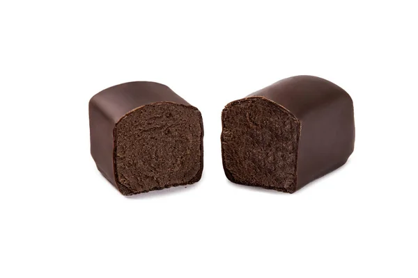Glazed chocolate cheese in milk chocolate broken into halves on a white isolated background