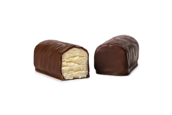 Glazed cheese in milk chocolate broken into halves on a white isolated background