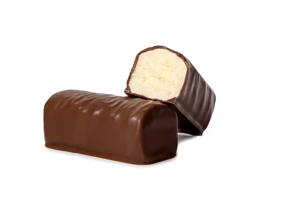 Glazed cheese in milk chocolate broken into halves on a white isolated background