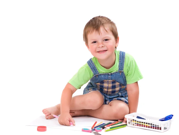 Funny boy with pencil sitting on the floor — Stock Photo, Image