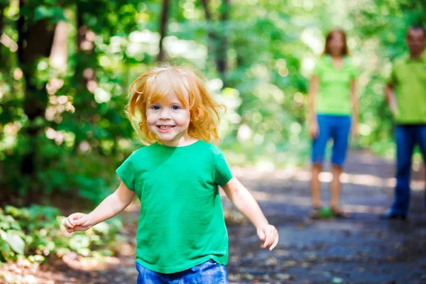 Portrait of Happy Little Girl running in park Stock Image