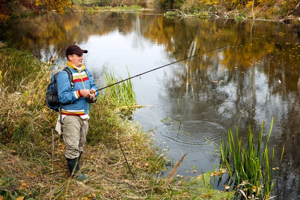 Fisherman with spinning. — Stock Photo, Image