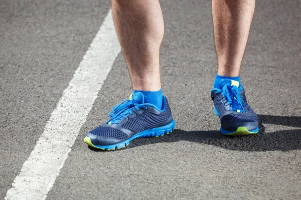 Closeup of a male runner standing. — Stock Photo, Image