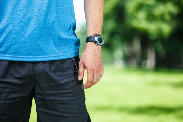 Closeup of a male runner standing - space for text. — Stock Photo, Image