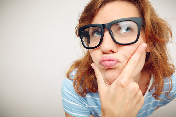 Portrait of Funny girl in doubt about something.