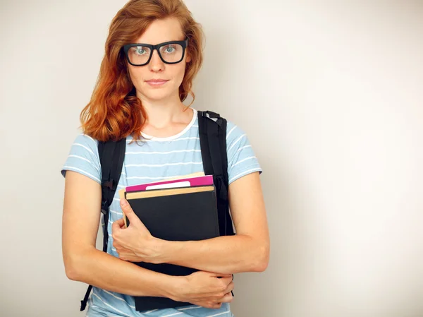 Portret van jonge slimme student met boeken. — Stockfoto