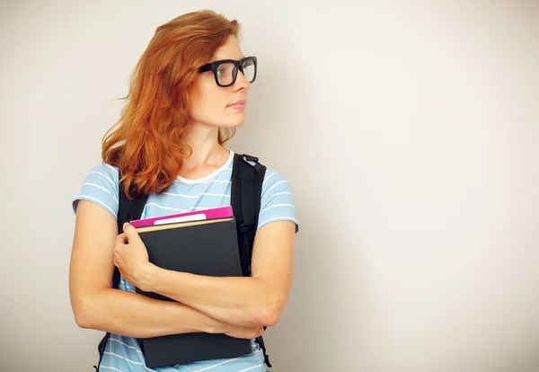 Retrato de joven estudiante inteligente con libros . —  Fotos de Stock