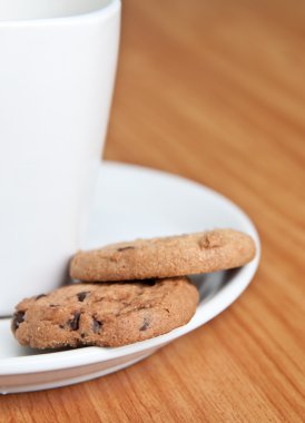 Coffee cup with cookie .