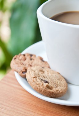 Coffee cup with cookie .