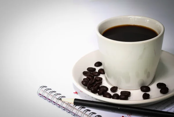 Xícara de café e caderno . — Fotografia de Stock