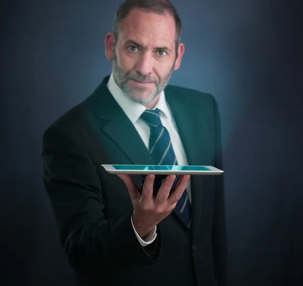 Smart Businessman shows the Tablet PC — Stock Photo, Image