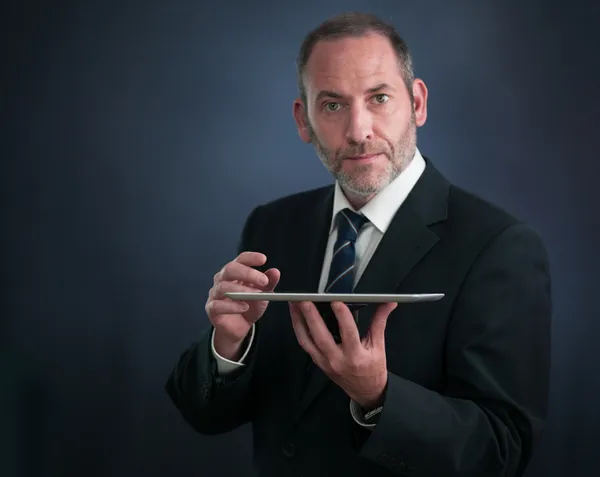 Smart Businessman shows the Tablet PC — Stock Photo, Image